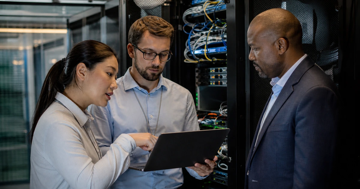 Cybersecurity engineer and private equity technology lead inspecting network infrastructure during acquisition diligence
