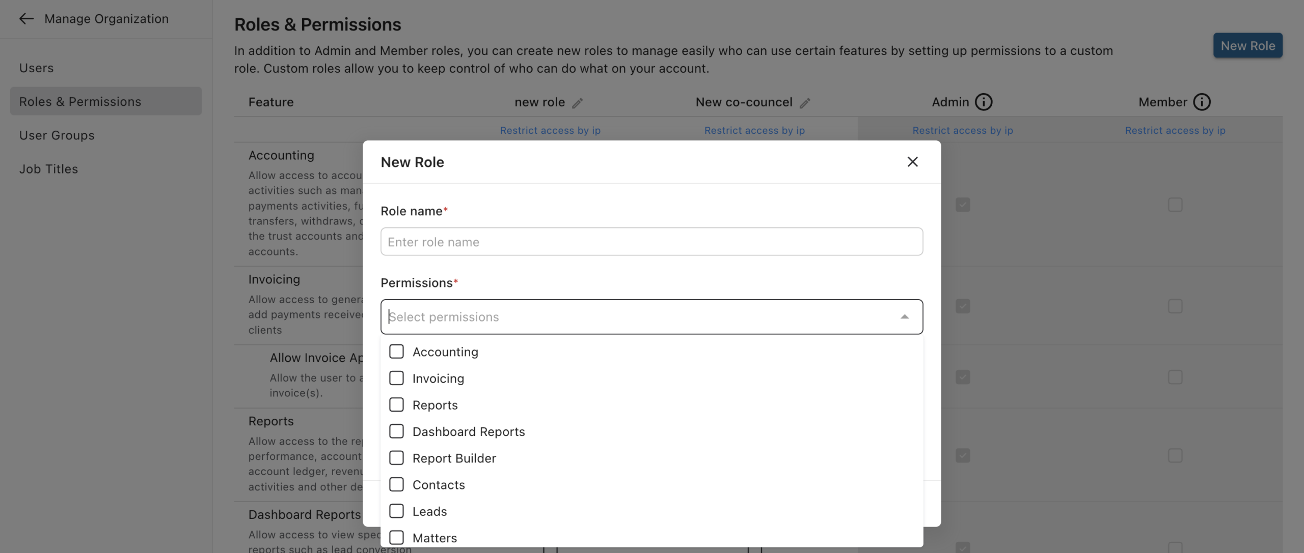 Lawcus New Role dialog with selectable feature permissions over the Roles & Permissions page.